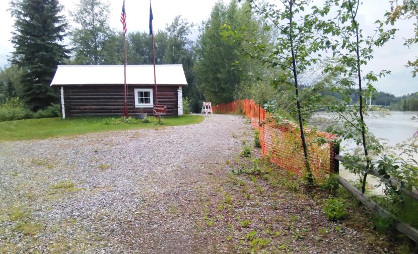 Alaska State Parks is trying to raise money for a riverbank-stabilization project that would halt the Tanana River from washing away the bank that's already been eroded to within 13 feet of this historic cabin at Big Delta State Historical Park. (Photo by Monica Gray/ Alaska State Parks )