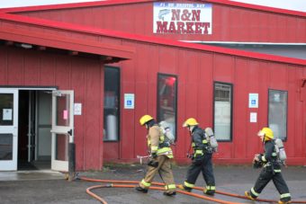 More than a dozen volunteer firefighters helped put out the fires inside the N&N grocery store Sunday morning. (Photo by KDLG)