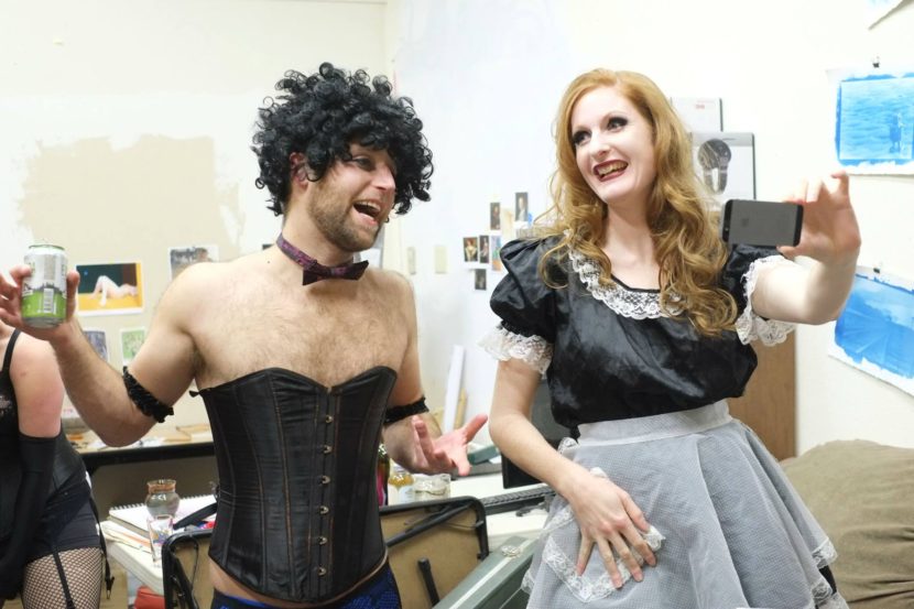 Alex Thompson and Melissa Patterson chat backstage during Gold Town Nickelodeon's screening of "Rocky Horror Picture Show" last year. (Photo by Annie Bartholomew/KTOO)