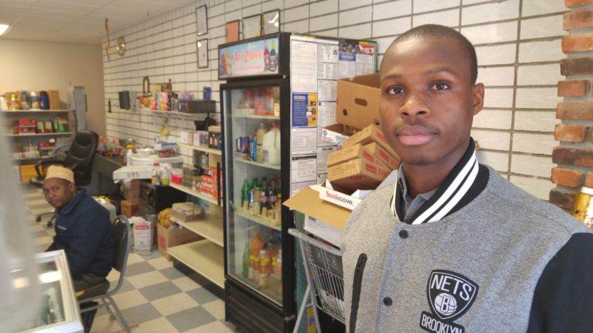 Mohamed Gabril, a refugee who became an American citizen, works at a Somali-owned grocery in Utica, N.Y. He's convinced the U.S. Constitution will protect him from any backlash under Donald Trump. Brian Mann/NCPR