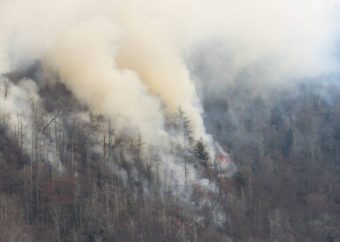 Smoke rises from wildfires in the Great Smoky Mountains near Gatlinburg, Tenn., on Tuesday. (Photo by Great Smoky Mountains National Park)