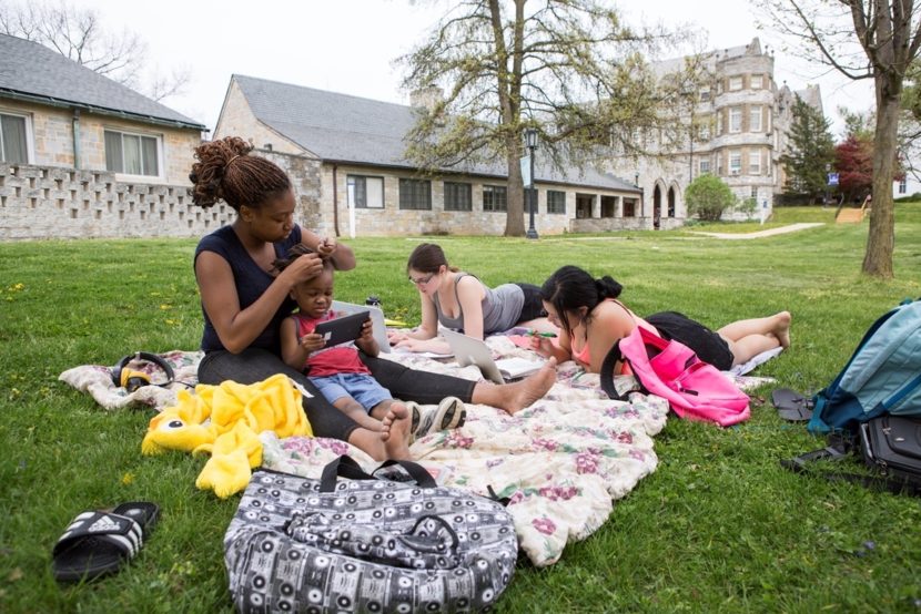 Student Cierra Valentine (left) studies with friends and her son Jeremiah on the lawn at Wilson College in Chambersburg, Pa. Ryan Smith/Courtesy of Wilson College