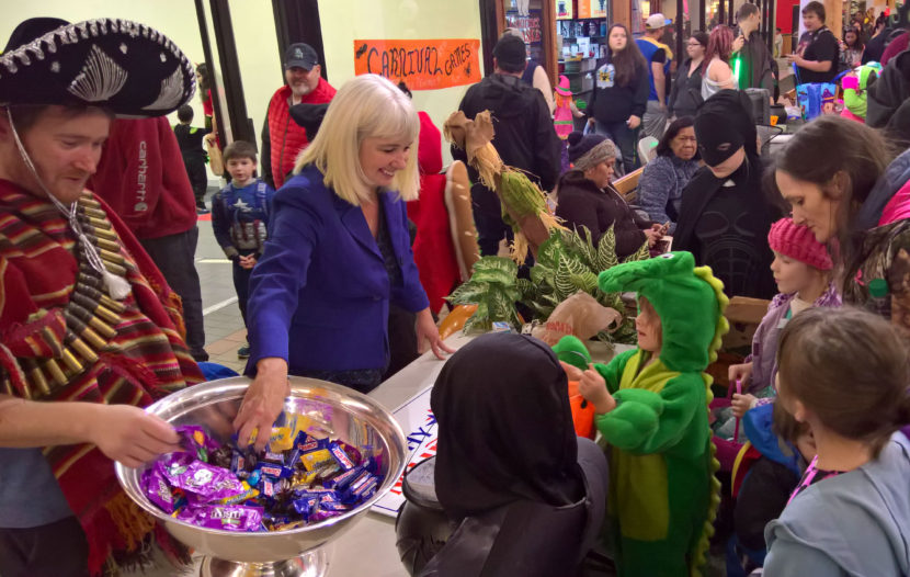 Rep. Cathy Muñoz runs a trick-or-treat table at the Nugget Mall as a campaign event, Oct. 31, 2016. She interacted with hundreds of people over two hours, most too young to vote. (Photo by Jeremy Hsieh/KTOO)