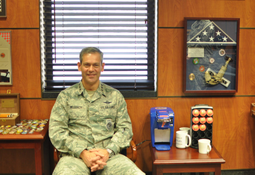 Lt. Gen. Kenneth Wilsbach in his office, surrounded by mementos and awards, including a University of Florida Gators coffee-maker. (Photo by Zachariah Hughes/Alaska Public Media)