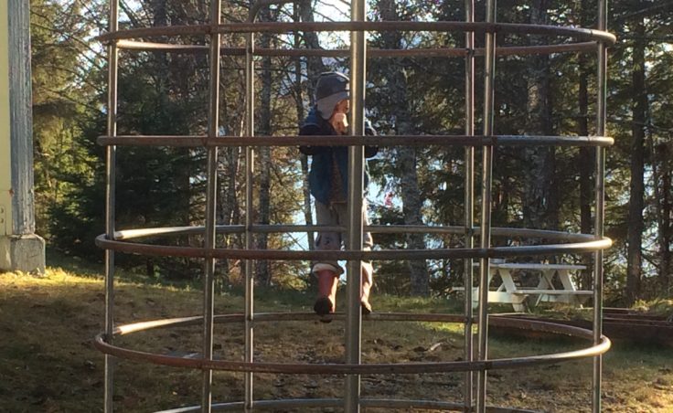 Ila Mannino climbs playground equipment at the Tenakee Springs Independent Learning Center in November 2016. (Photo by Quinton Chandler/KTOO)