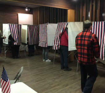 Voters fill out ballots Tuesday at First American Baptist Church in Anchorage. Only two House seats changed hands. Nov. 8, 2016. (Photo by Andrew Kitchenman/KTOO/APRN)
