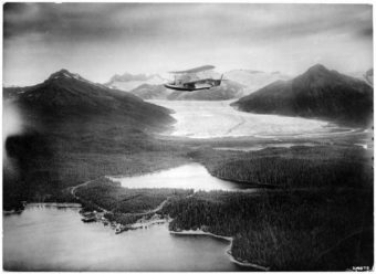 A Navy biplane flies over Juneau in 1926. (Photo by U.S. Navy Alaska Aerial Survey Expedition/Courtesy Alaska State Library - Historical Collections)