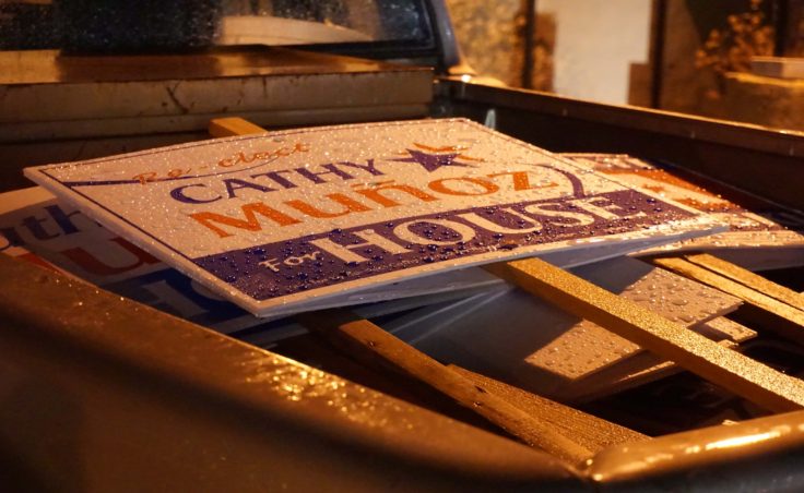 Rain beads on Cathy Munoz campaign signs in the back of a truck outside her campaign party, Nov. 8, 2016. (Photo by Jeremy Hsieh/KTOO)