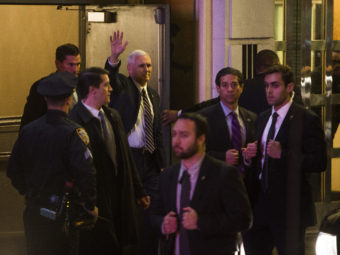 Vice President-elect Mike Pence, top center, leaves the Richard Rodgers Theatre after a performance of "Hamilton" on Friday. Andres Kudacki/AP