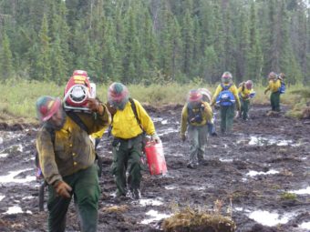 Firefighters head to the fire line on the Spicer Creek Fire northeast of Tanana in 2015. (AFS Photo.)