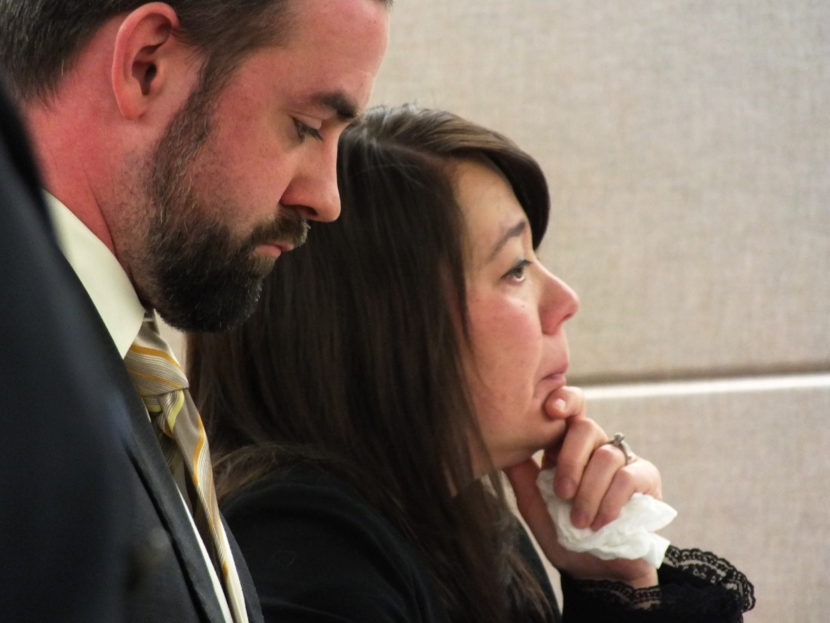 Defense attorney Kevin Higgins and defendant Christena Leamer listen as District Attorney James Scott speaks during a sentencing hearing on Wed., Dec. 15.