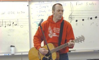 Gastineau Elementary School music teacher Patrick Murphy leads his class in song. (Photo by Ed Schoenfeld/CoastAlaska News)