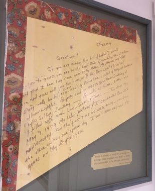 Letter written on the wall by Phyllis Sundberg, framed in the house in which it was found. (Photo by Kayla Desroches/KMXT)