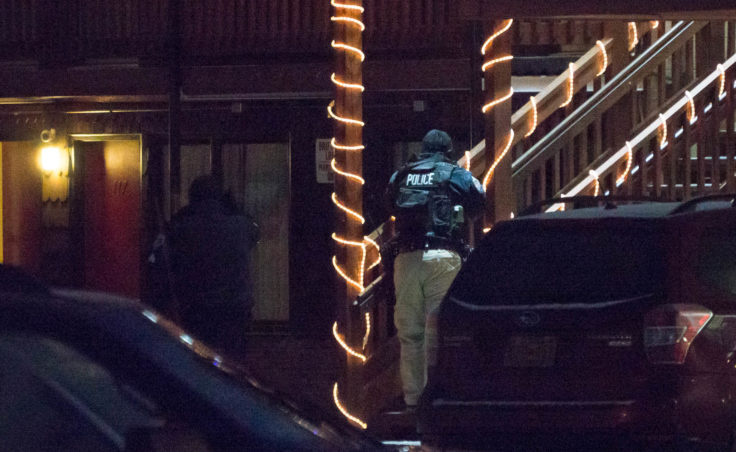 Juneau police at the Driftwood Hotel on Dec. 16, 2016. (Photo by David Purdy/KTOO)