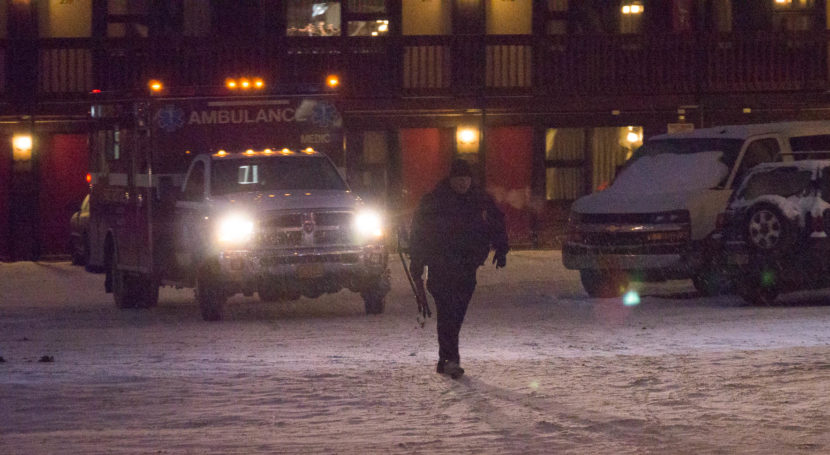 An ambulance and Juneau police officer at the Driftwood Hotel, Dec. 16, 2016. (Photo by David Purdy/KTOO)