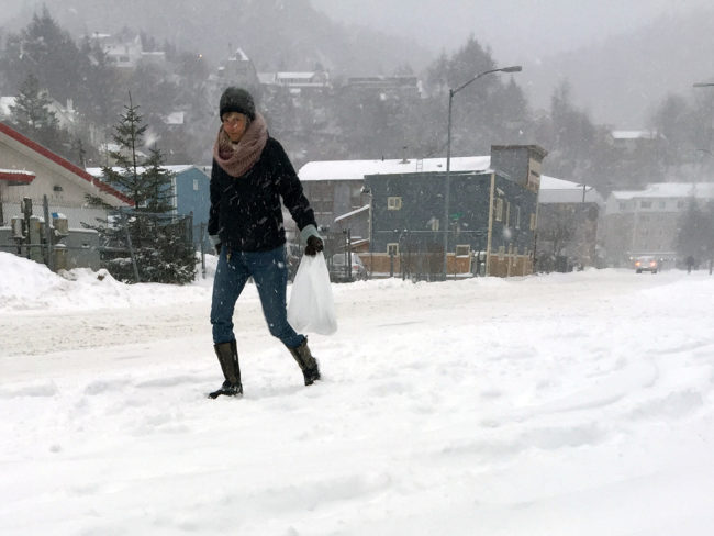 A pedestrian walks through a snowstorm on Dec. 7, 2016 in Juneau, Alaska. 