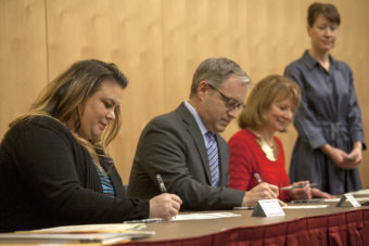 Jacqueline Tupou, Sean Parnell and Carolyn Leman sign their Electoral College votes for Donald Trump during a ceremony on Monday Jan. 19, 2016 in Juneau, Alaska. (Photo by Rashah McChesney/Alaska's Energy Desk)