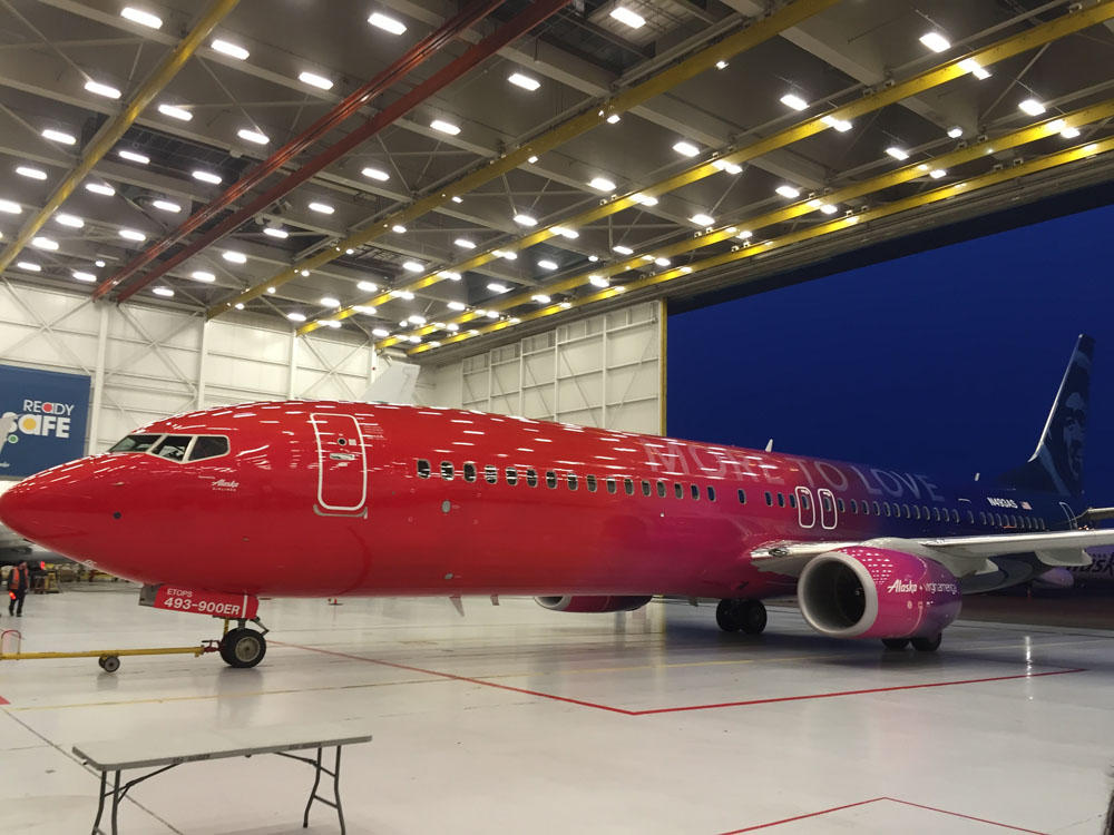 On Wednesday morning at SeaTac Airport, Alaska Airlines employees boarded a Boeing 737 specially painted to celebrate the newly-consummated merger with rival Virgin America. (Photo by Tom Banse/Northwest News Network)