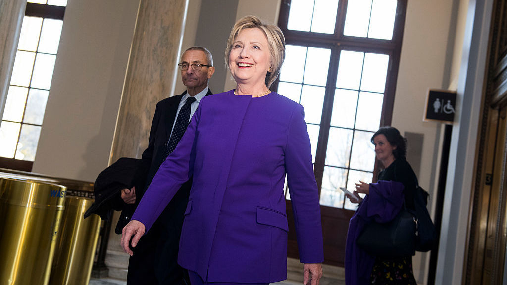 Former Secretary of State Hillary Clinton and John Podesta arrive for a portrait unveiling ceremony for retiring Senate Minority Leader Harry Reid, D-Nev., last week. (Photo by Tom Williams/CQ-Roll Call Inc.)