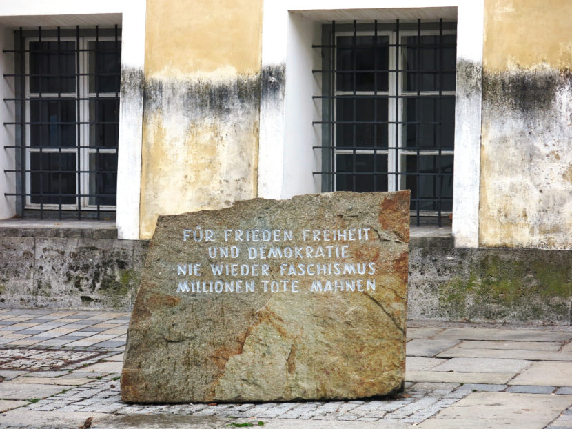 This jagged stone in front of Adolf Hitler's birth house in Branau am Inn comes from the former Mauthausen concentration camp, a 90-minute drive away. The inscription reads: "For peace, freedom and democracy. Never again fascism. Millions dead are a warning." Soraya Sarhaddi Nelson/NPR