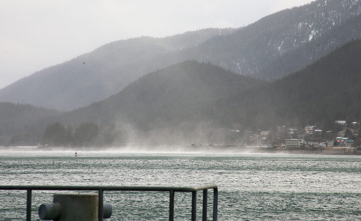 A cold weather phenomenon known as the Taku winds causes white caps and water to mist into the air on Friday, January 6, 2017, on the Gastineau Channel as seen from the U.S. Coast Guard Juneau station. National Weather Service issued a high wind warning for Juneau and Southeast Alaska that will last until Sunday afternoon, January 8, 2017. The warning was for hazardous high winds of about 60 to 80 mph. (Photo by Tripp J Crouse/KTOO)