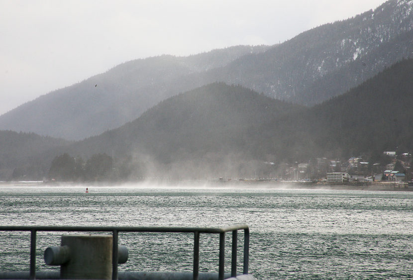 A cold weather phenomenon known as the Taku winds causes white caps and water to mist into the air on Friday, January 6, 2017, on the Gastineau Channel as seen from the U.S. Coast Guard Juneau station. National Weather Service issued a high wind warning for Juneau and Southeast Alaska that will last until Sunday afternoon, January 8, 2017. The warning was for hazardous high winds of about 60 to 80 mph. (Photo by Tripp J Crouse/KTOO)