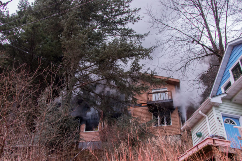 Structure fire on Basin Road reignites on the morning of Tuesday. (Photo by Mikko Wilson/KTOO)