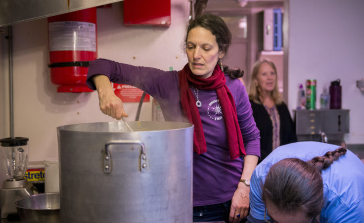 Governor's policy adviser Rebecca Braun volunteers in the Glory Hole soup kitchen and shelter on Friday, Dec. 30, 2016.