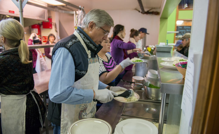 Lt. Gov. Byron Mallott volunteers in the kitchen of the Glory Hole soup kitchen and shelter on Friday, Dec. 30, 2016.