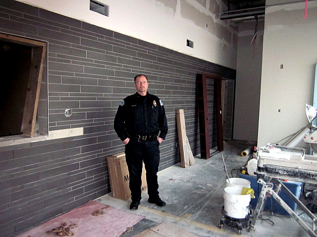 Petersburg Police Chief Kelly Swihart stands in the unfinished lobby near the front entrance of the new police department. (Photo by Angela Denning/KFSK)