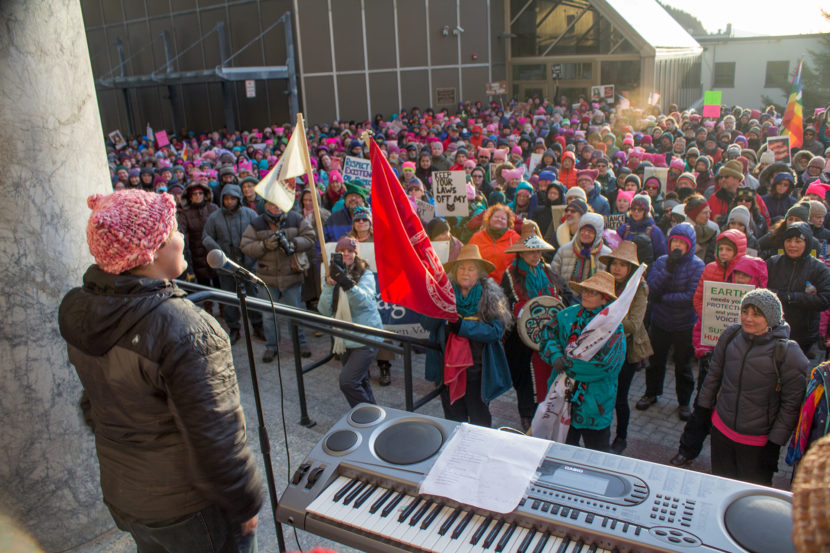 Theo Houck addresses protesters at the Alaska State Capitol for the Women's March on Saturday January 21st, 2017 in Juneau. (Photo by Mikko Wilson/KTOO)