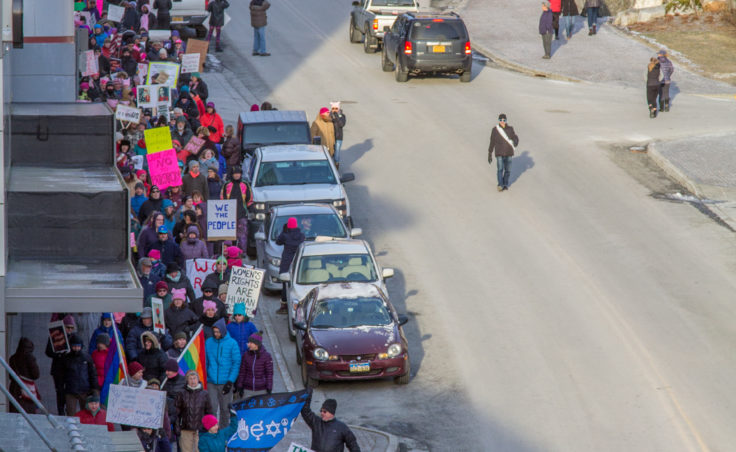 Protesters walk down Main Street as part of the Women's March on Saturday, Jan. 21, 2017, in Juneau. (Photo by Mikko Wilson/KTOO)