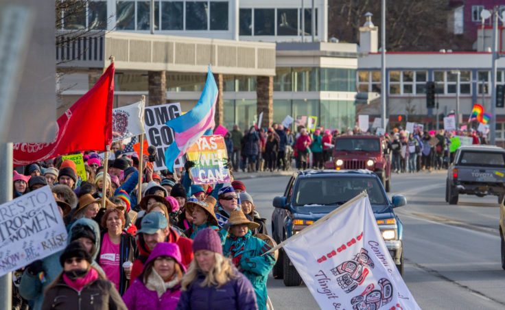 Protesters walk along Egan Drive as part of the Women's March on Saturday, Jan. 21, 2017, in Juneau. (Photo by Mikko Wilson/KTOO)