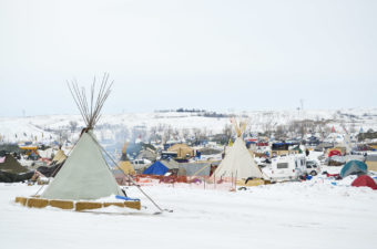 Several hundred protesters remain camped on the North Dakota prairie in opposition to the Dakota Access Pipeline. They have erected shelters from Army tents to teepees to wooden structures to stay warm this winter. (Photo by Amy Sisk/Inside Energy)