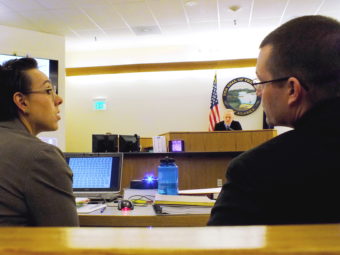 Assistant District Attorney Amy Paige confers with Juneau Police Sgt. Shawn Phelps before responding to Judge Philip Pallenberg during trial on Friday, Feb. 10, 2017.