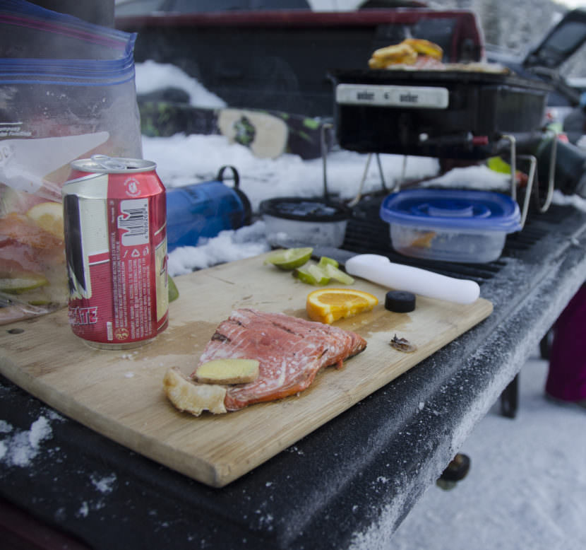 A filet of salmon is prepped for the barbecue on Dec. 13, 2015, in the parking lot of Eaglecrest Ski Area. (Photo courtesy Sarah Cannard)