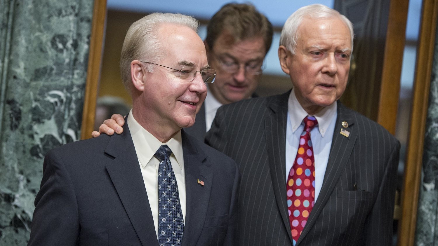 Rep. Tom Price, R-Ga., center, nominee for Health and Human Services secretary, is seen with Chairman Orrin Hatch, R-Utah, before his Senate Finance Committee confirmation hearing on Jan. 24. (Photo by Tom Williams/CQ-Roll Call Inc.)