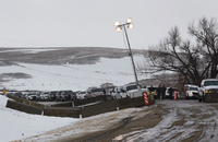 Police vehicles line up at a roadblock ahead of Wednesday's evacuation deadline. (Photo by Angus Mordant for NPR)