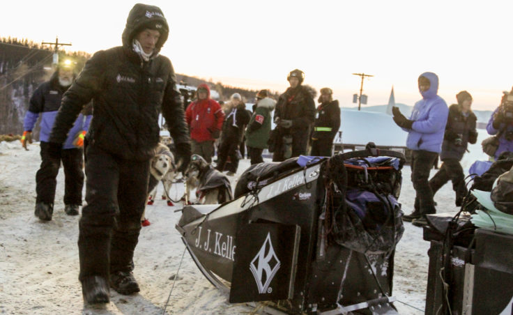 Upon arriving in Ruby, Dallas Seavey quickly attended to chores during the Iditarod. (Photo by Zachariah Hughes/Alaska Public Media)