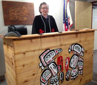 Presiding Judge Debra O'Gara stands in the Juneau courtroom of the Central Council of Tlingit and Haida Indian Tribes of Alaska. (Photo by Ed Schoenfeld/CoastAlaska News)