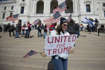 About 700 people gathered at the Minnesota capitol in St. Paul to show support for Republican President Donald Trump on March 4, 2017. It was one of many "March 4 Trump" events held around the country. About 100 people were also there protesting against Donald Trump.