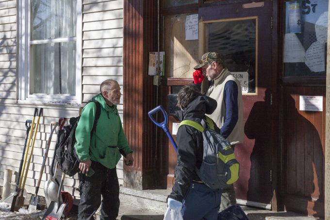 Residents of the Bergmann Hotel talk about what they’re supposed to do before police showed up to remove them from the building on Friday, March 10, 2017 in Juneau, Alaska.