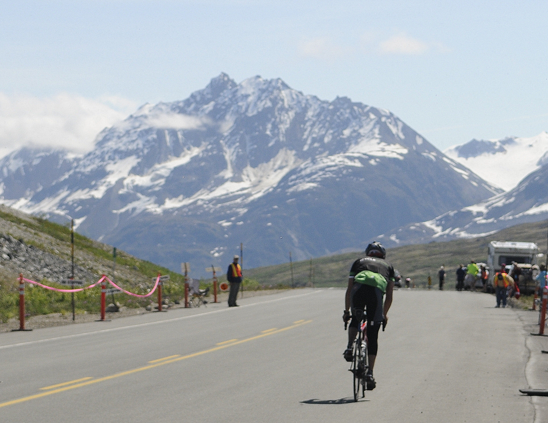 A solo rider crests the summit during the 2016 Kluane-Chilkat International Bike Relay. (Photo by Jillian Rogers/KHNS)