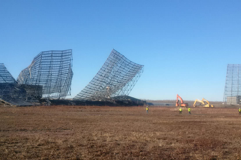 Workers pull down old radar structures that were part of the now-defunct Ballistic Missile Early Warning System at Clear Air Force Station in October. The Cold War-era BMEWS was removed and recycled to make way for new construction. About a billion dollars’ worth of work is under way at Clear, related to installation of the a new radar system that will provide much greater coverage for such missile-defense facilities as the base at Fort Greely. (U.S. Air Force Space Command)