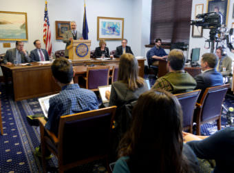 Senate President Pete Kelly, R-Fairbanks, talks to reporters at a Senate Majority press availability on Thursday. April 13, 2017, in Juneau. Sens. Lyman Hoffman, D-Bethel, Peter Micciche, R-Soldotna, Anna MacKinnon, R-Anchorage, and Kevin Meyer, R-Anchorage, seated left to right, also participated.