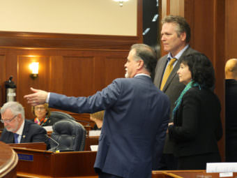 Majority Leader Peter Micciche, R- Soldotna, Sen. Mike Dunleavey, R-Wasilla, and Sen. Shelley Hughes, R-Palmer, (left to right) talk during an at-ease on the Senate Floor, April 6, 2017. (Photo by Skip Gray/360 North)