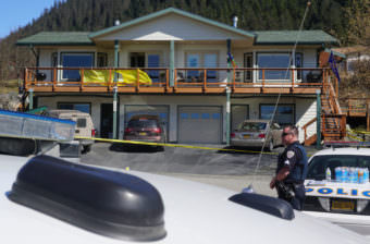 Juneau police Sgt. Chris Gifford keeps watch at a possible crime scene on Abby Court, where a 44-year-old Juneau woman was found dead