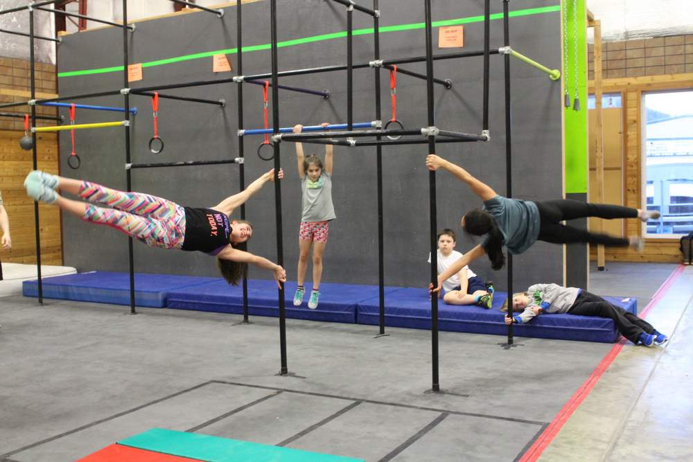 Impressive feats aren’t hard to find at the Kronos gym, which shares space and management with a local gymnastics and circus program. (Photo by Emily Kwong/KCAW)
