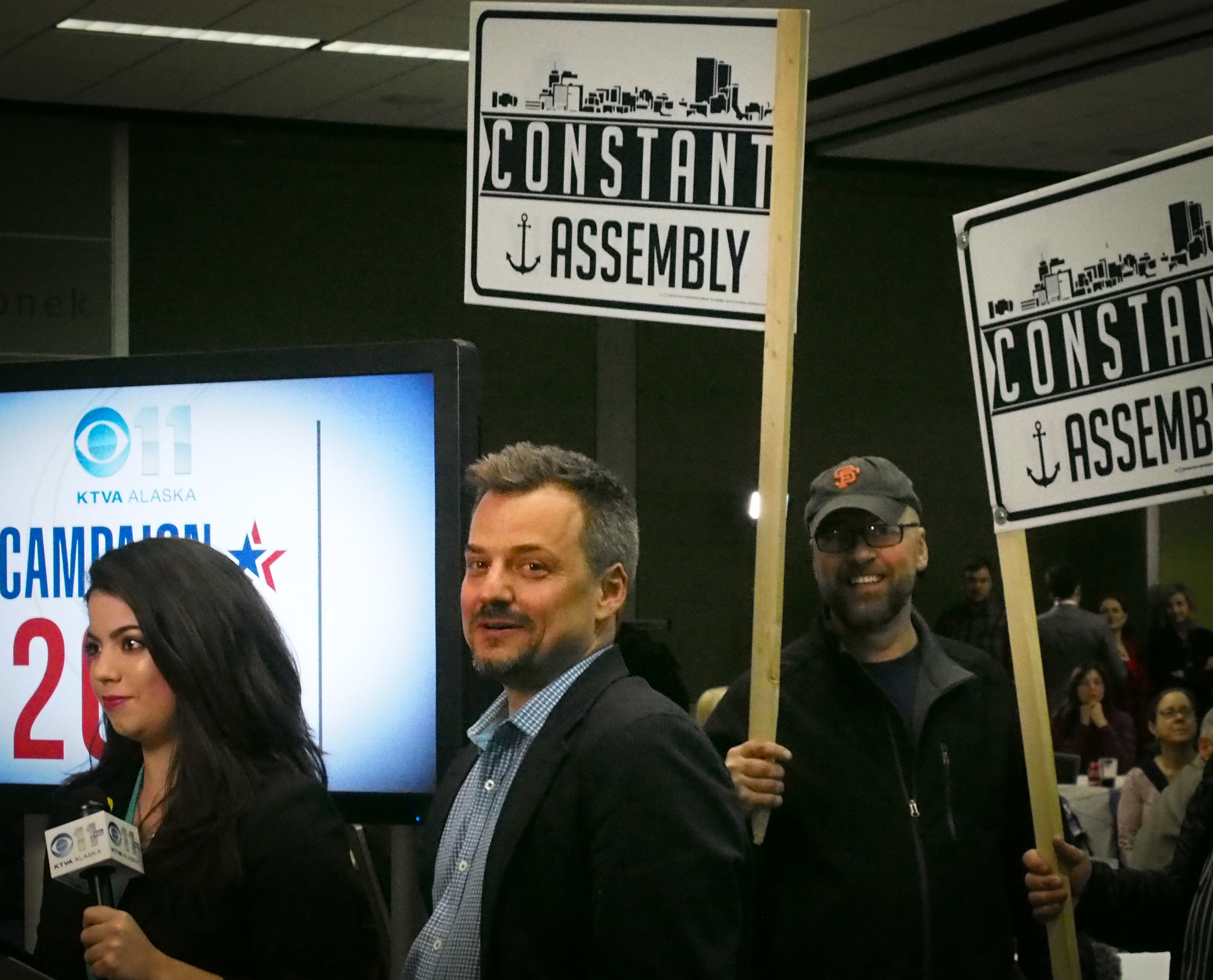 Christopher Constant celebrates Tuesday, April 4, 2017, with a victory lap at Election Central in Anchorage’s Denai’ina Center. (Photo by Zachariah Hughes/Alaska Public Media)