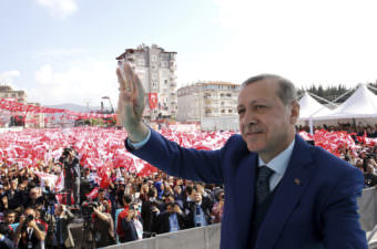 Turkish President Recep Tayyip Erdogan addresses supporters Friday in the southern province of Hatay. Erdogan says the U.S. missile strike on a Syrian air base is a "concrete step" but argues that it's not enough.